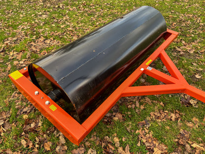 FarmMaster tractor land roller on grass with leaves