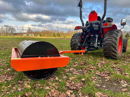 Tractor with a FarmMaster tractor land roller attachment on a field