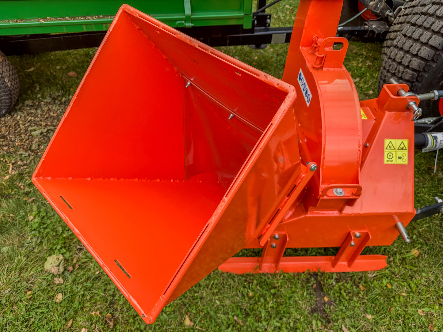 FarmMaster tractor wood chipper on a grassy field