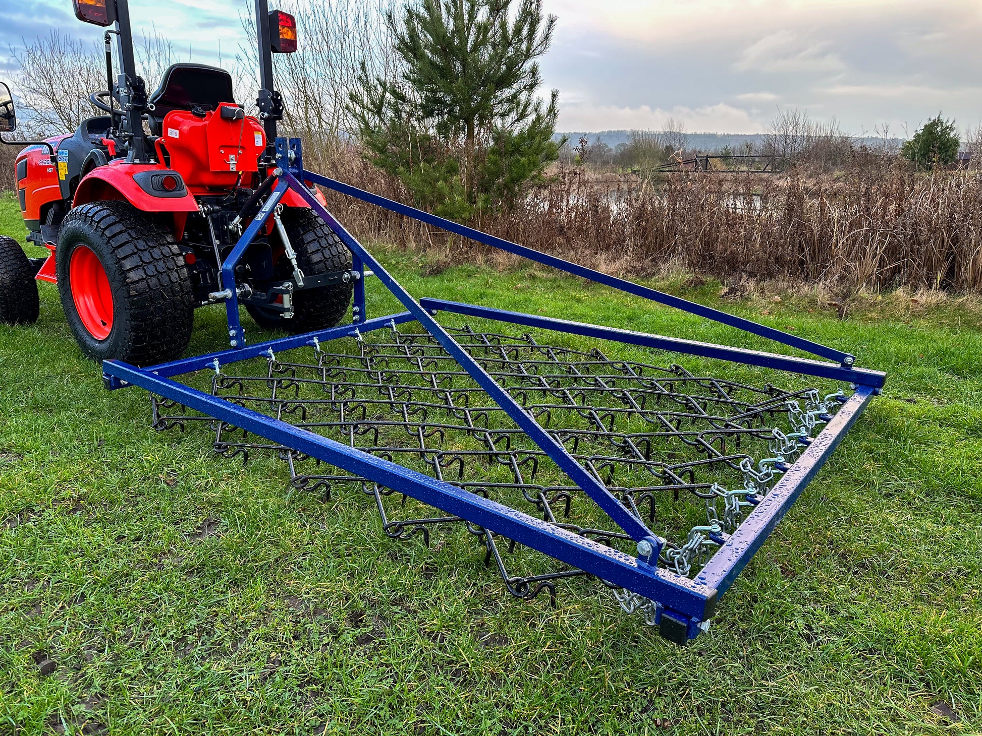 FarmMaster Framed Chain Harrow on a grassy field.