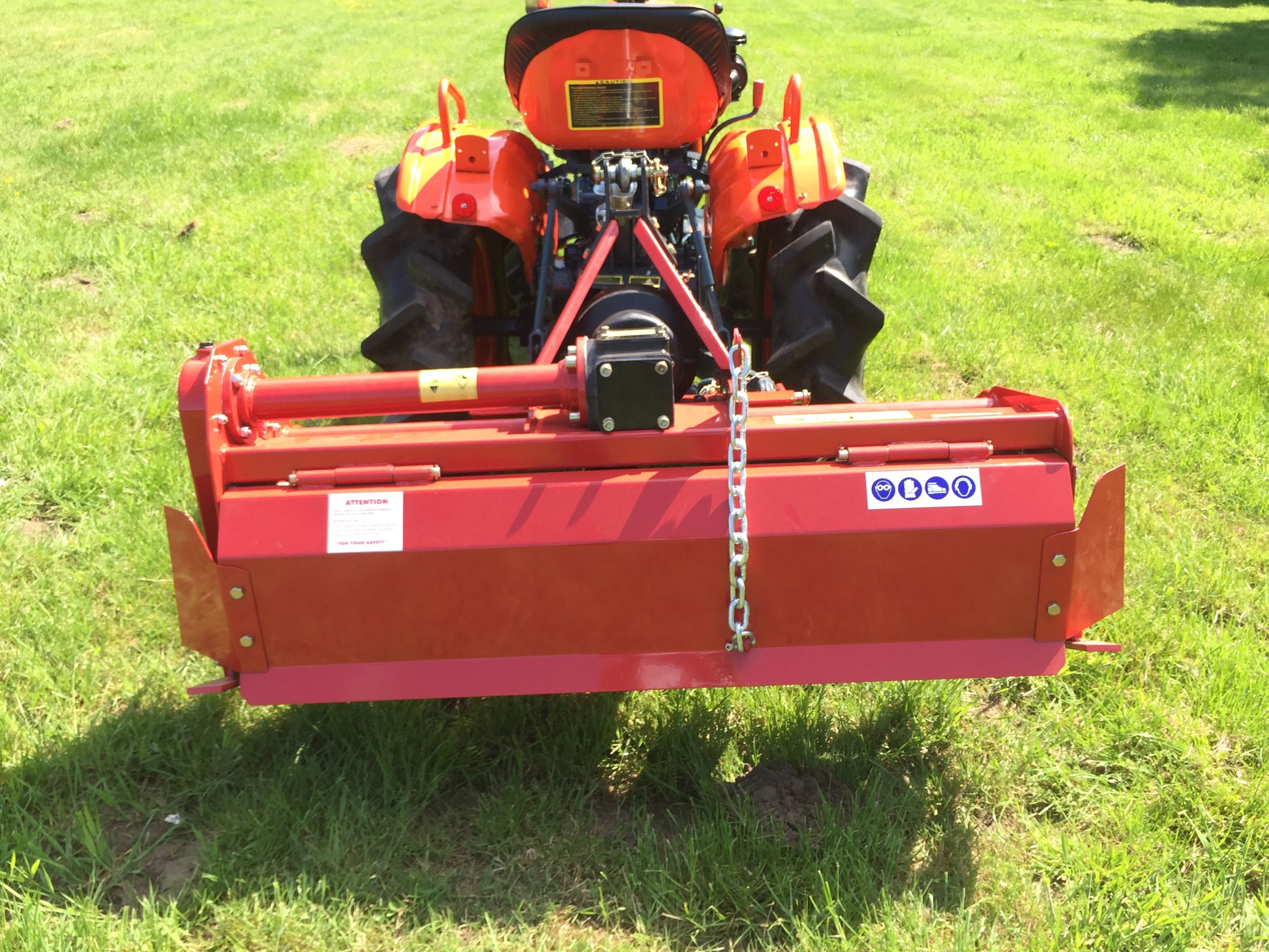 FarmMaster tractor rotavator on a grassy field