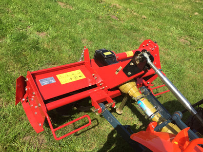 FarmMaster tractor tiller on a grassy field