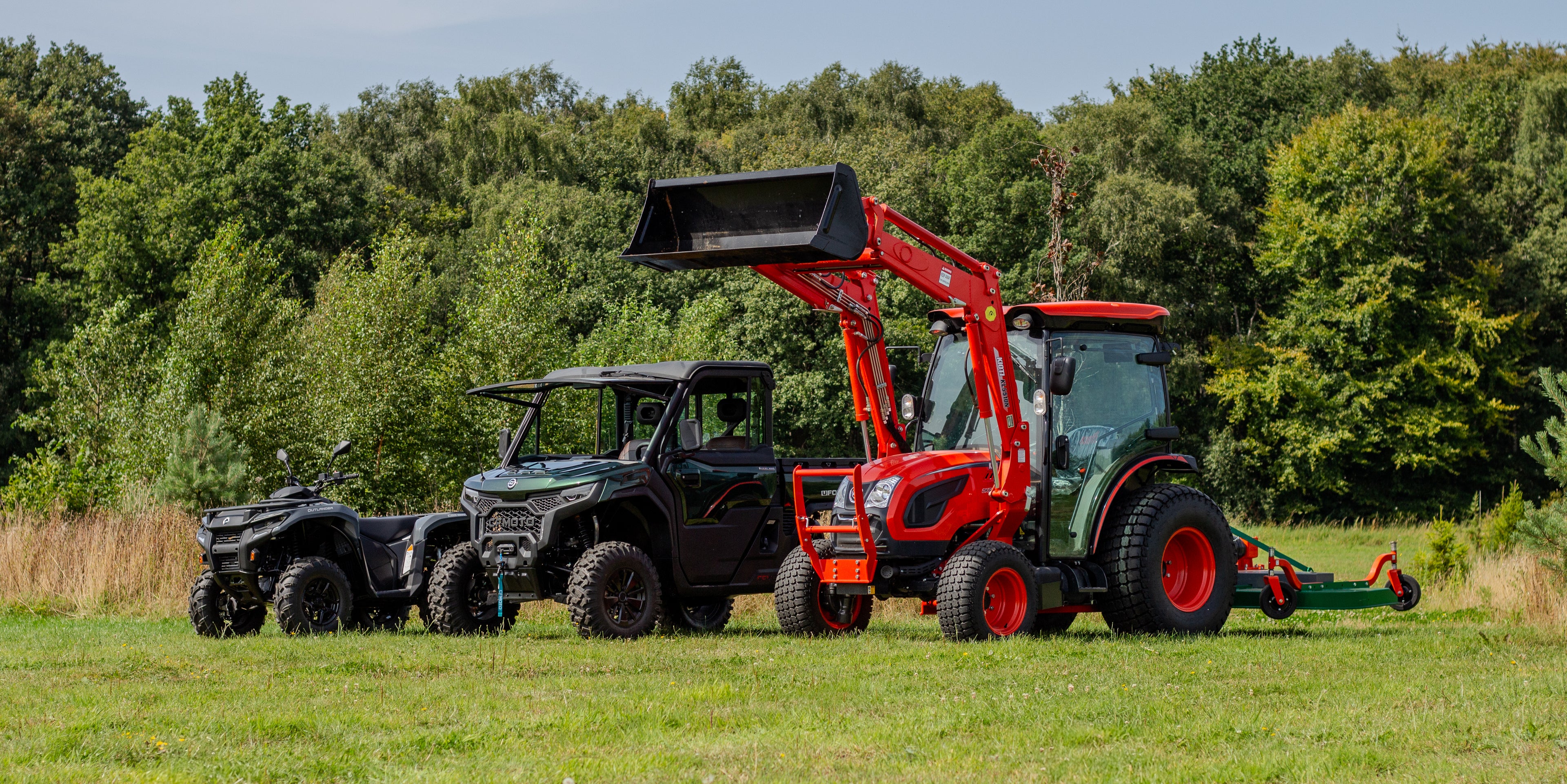 Tractor, UTV and ATV in a field