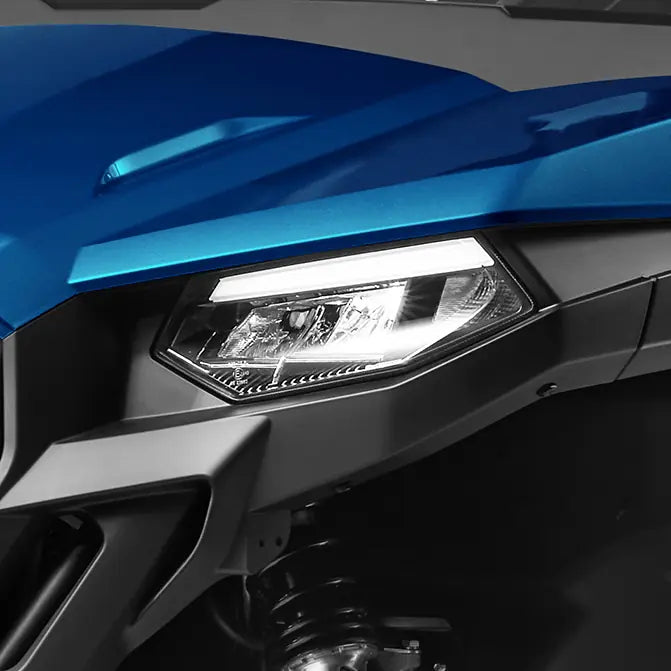 Close-up of a blue CFMOTO U600 headlight