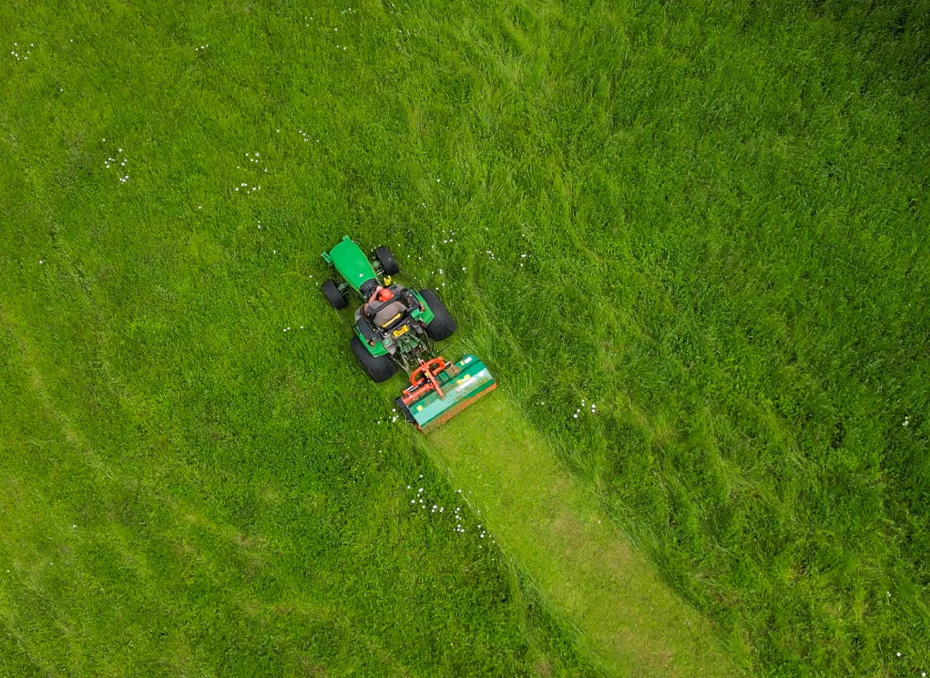 Person mowing a lawn from an aerial perspective