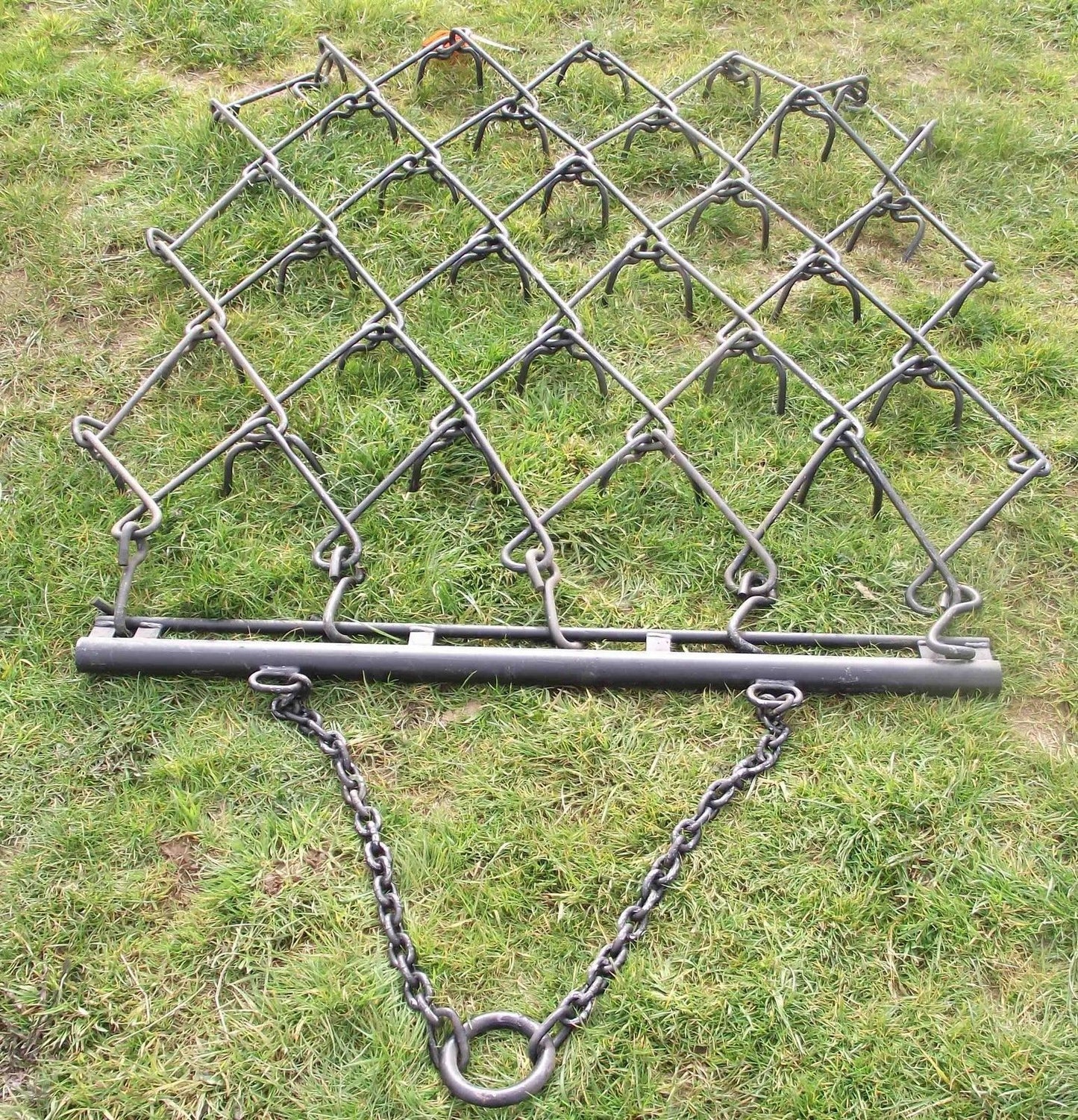 Chain harrow on grass