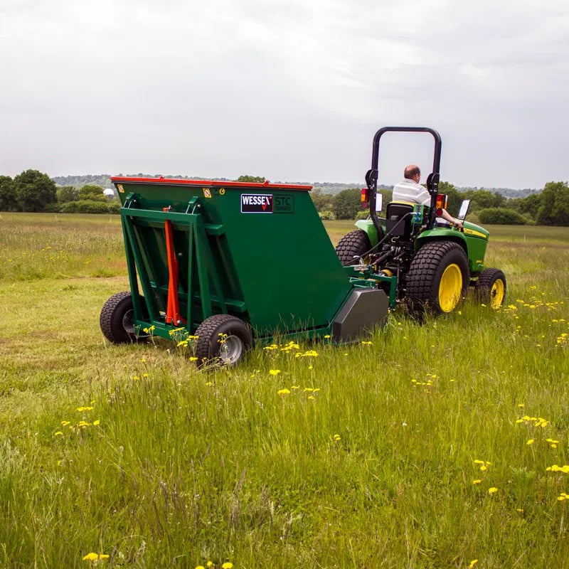 Person operating a Wessex flail collector in a field