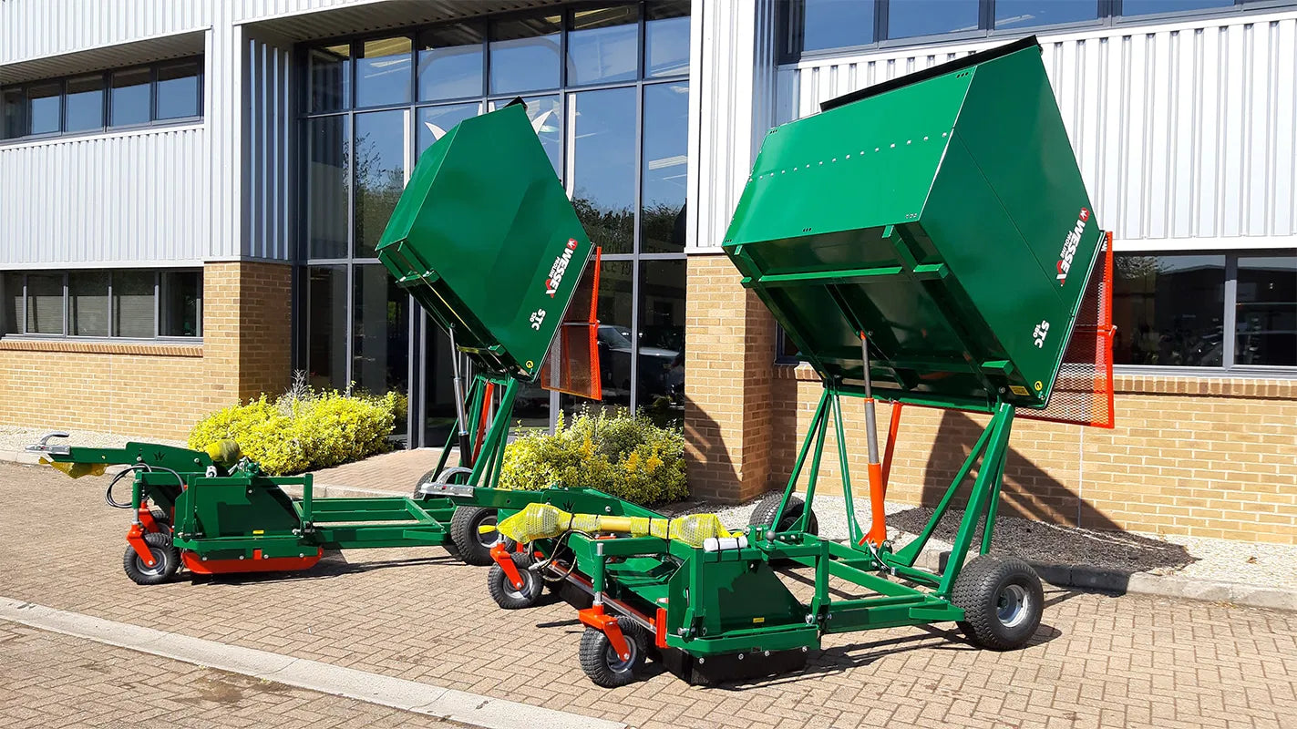 Two Wessex flail collector on a brick driveway with a building in the background